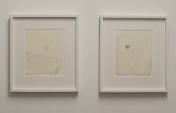 Ηolding 1 and 2,  2008, Pencil drawing on used photo album paper,  26 x 20.5 (each unframed)